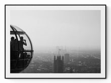Load image into Gallery viewer, Black and white photograph of the London Eye emerging from Thames fog, seen from the South Bank
